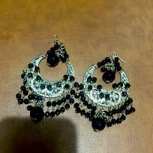 Gold tone and black costume earrings